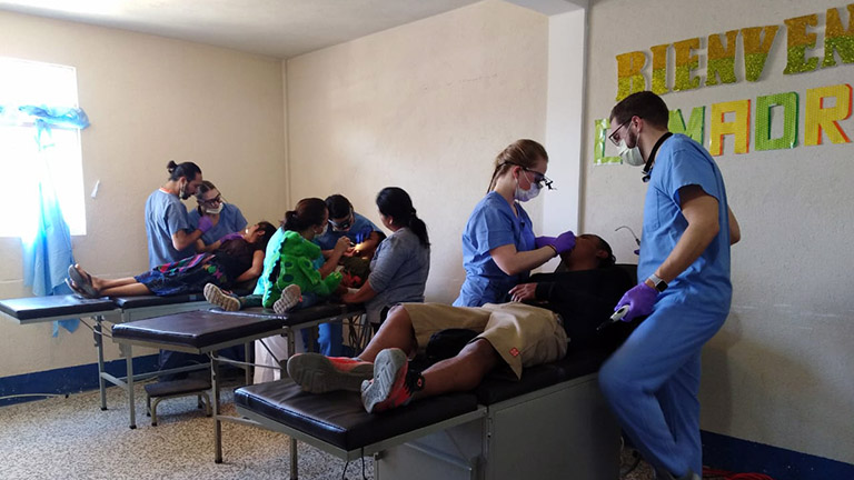Student dentists treat patients in a community clinic