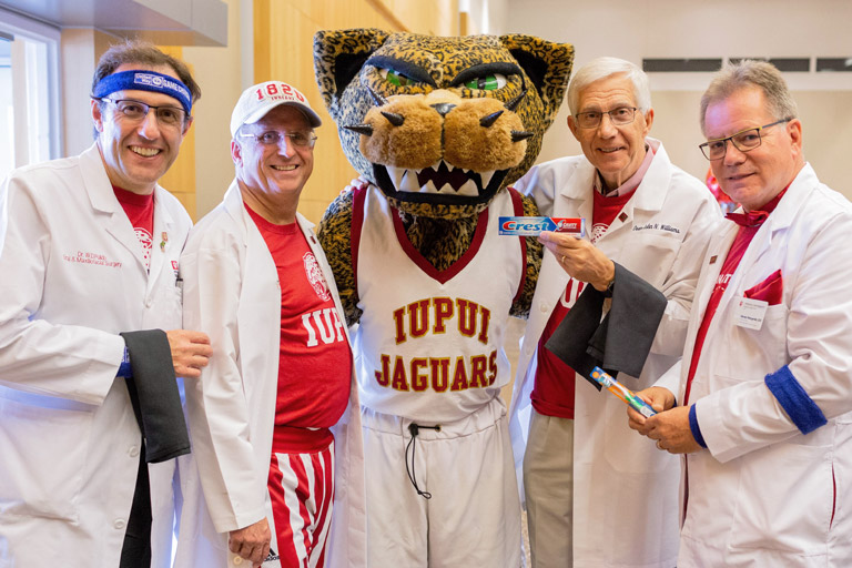 Dr. John N. Williams Jr. stands with other doctors and the IUPUI Jaguars mascot.